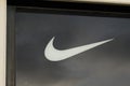 Nike logo sign front of store of sporty American shop multinational corporation