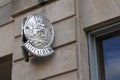 Notaire french sign logo and text silver on wall aside entrance to the notary office