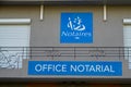 Notary french office notarial notaire text sign and logo front of building agency