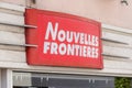 Nouvelles frontieres logo red and white text sign front of travel agents store in Royalty Free Stock Photo