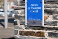 Office de tourisme classÃÂ© French tourism office sign label rated on facade wall in