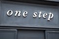 one step brand sign and text logo front facade store fashion women boutique