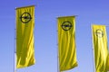 opel logo brand car sign text in three yellow flag in blue sky Royalty Free Stock Photo