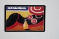 Orangina orange lemonade logo sign and brand text on advertising plate