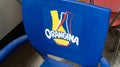 Orangina orange lemonade logo sign and brand text on plastic advertising seat