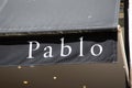 pablo logo text and brand sign on entrance feminine light fashion store facade in the