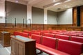 Panoramic view of interior courtroom in court of justice with witness desk and defense Royalty Free Stock Photo