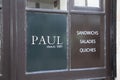 Paul text sign and logo brand of french bakery store entrance facade fast food