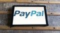 PayPal sign logo and brand text on screen tablet payment system on internet web bank