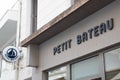 Petit Bateau child fashion store brand text and logo sign shop facade Small boat