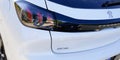 Bordeaux , Aquitaine / France - 02 11 2020 : Peugeot 208 e-208 Electric car rear view back rear light white modern french