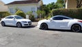 Bordeaux , Aquitaine / France - 06 10 2020 : Peugeot rcz and Audi TT coupe white design in face to face sport car parked In Street Royalty Free Stock Photo