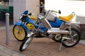 Peugeot 103 sp chooper and mbk 51 caferacer french vintage retro moped parked in city