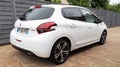 Peugeot 208 white french car Gt-Line side rear street view