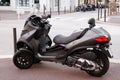 Piaggio MP3 500 lt motorbike three wheels scooter parked in city street motorcycle