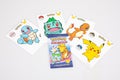 Pokemon logo brand and text sign on children card collection on table