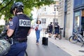 Policeman with text sign and symbol logo of French national police in city street