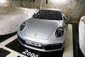 Porsche 911 grey modern sport car in public underground parking
