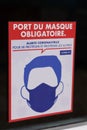 Port du masque obligatoire text banner french sign on store entrance against covid 19