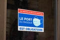 Port du masque obligatoire text french sign on windows store restaurant entrance