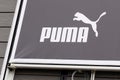 puma logo brand and text sign front of building shop for fashion store clothing company