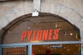 pylones logo sign and brand text front wall entrance facade shop chain objects