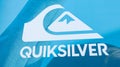 Quiksilver logo facade and text sign front of shop chain entrance of fun clothes