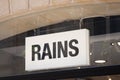 rains logo brand and text sign on wall facade storefront fashion business