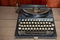 Remington portable ancient typewriter on old wooden desk