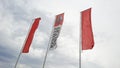 Renault trucks logo and text sign on waving flag front of dealership store bus van