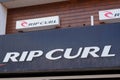 Rip curl logo brand and text sign front of store surf skate clothes boardshort shop
