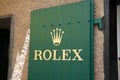 Rolex brand logo and text sign on store chain entrance Swiss luxury watch manufacturer