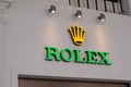 Rolex brand logo and text sign on store entrance Swiss luxury watch manufacturer from