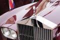 Rolls Royce classic car headlight and logo brand and sign text on radiator grill with Royalty Free Stock Photo