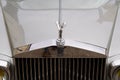Rolls Royce silver classic car headlight and logo brand and sign text on radiator