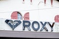 Roxy facade logo text sign on store entrance of surf brand shop for women of Royalty Free Stock Photo