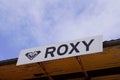 Roxy logo brand and text sign on facade surf fashion shop for women part of Quiksilver Royalty Free Stock Photo