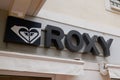 Roxy logo and text sign of surf brand shop for women part of Quiksilver group