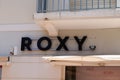 Roxy logo text and sign wall of surf brand exterior facade shop entrance