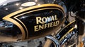 Royal Enfield black gold bullet fuel tank logo sign on motorcycle