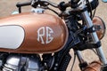 Royal Enfield logo brand and text sign on Indian motorbike fuel petrol tank brown Royalty Free Stock Photo