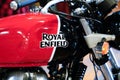 Royal Enfield logo and text sign on Indian motorbike fuel petrol tank red black of Royalty Free Stock Photo