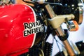 Royal Enfield logo and text sign on Indian motorbike steel tank red black color of Royalty Free Stock Photo