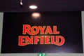 Royal Enfield motorcycle logo brand and text sign of indian motorcycle dealership wall Royalty Free Stock Photo