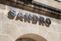 sandro sign text and logo brand on wall facade entrance on fashion clothes