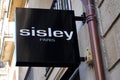 Sisley paris logo and sign text front of store fashion brand clothes shop in street