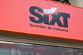 Sixt logo brand and text sign for Car Rent on wall facade agency shop exterior