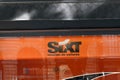 Sixt logo and text sign for Car Rental agency windows shop