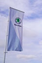 Skoda store dealership sign and text logo on flag of car Czech automobile