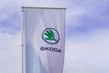 Skoda store dealership sign and text logo on flag of car store Czech automobile